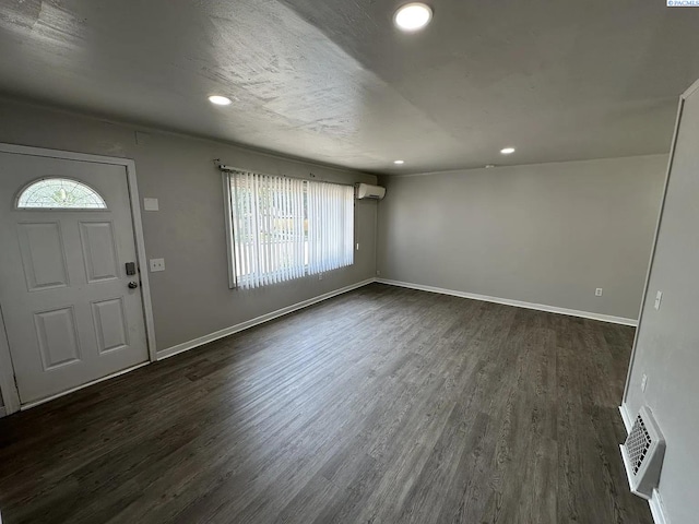 1529 Mcpherson Ave, Richland, WA 99352 - foyer with dark wood finished floors, baseboards, visible vents, and a wall mounted AC
