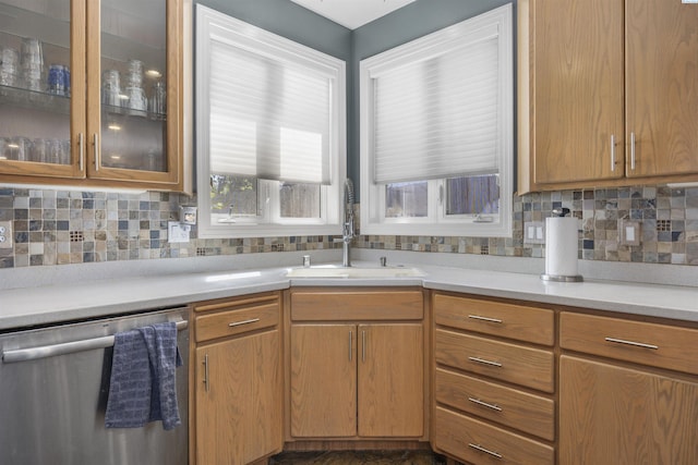 3501 W 42nd Ave, Kennewick, WA 99337 - kitchen featuring dishwasher, a sink, light countertops, decorative backsplash, and glass insert cabinets