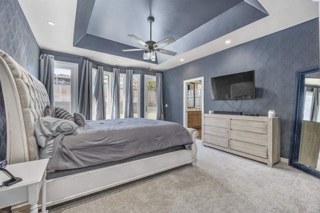 3501 W 42nd Ave, Kennewick, WA 99337 - bedroom featuring light carpet, a raised ceiling, multiple windows, ensuite bath, and wallpapered walls