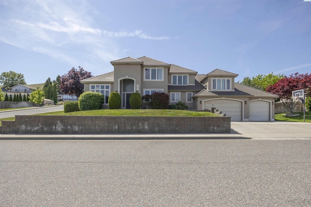 3501 W 42nd Ave, Kennewick, WA 99337 - view of front of home with driveway, a tiled roof, an attached garage, and a front yard