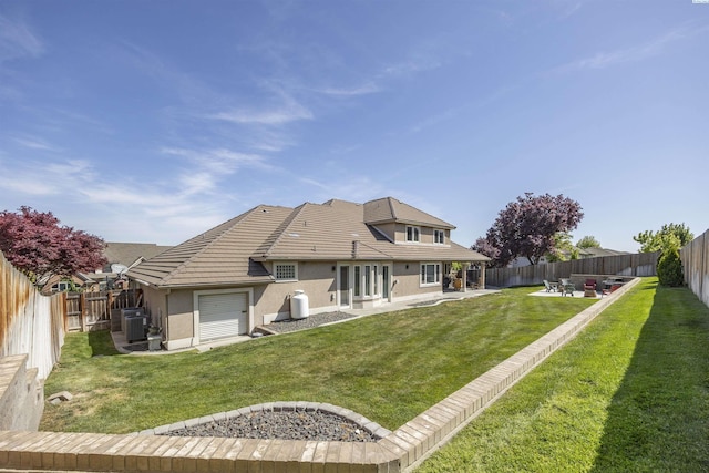 3501 W 42nd Ave, Kennewick, WA 99337 - back of house with stucco siding, a patio, central air condition unit, a tile roof, and an attached garage