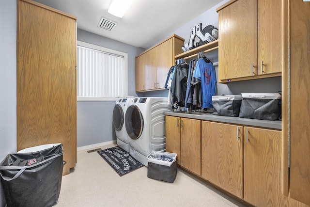 3501 W 42nd Ave, Kennewick, WA 99337 - laundry area featuring cabinet space, separate washer and dryer, and baseboards