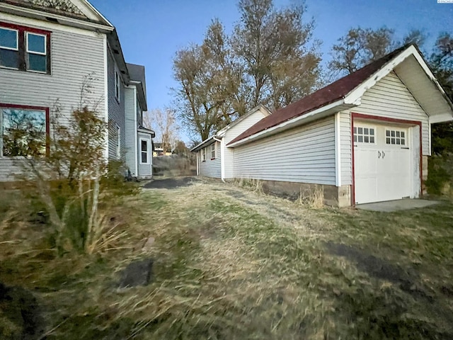 view of side of home with a garage