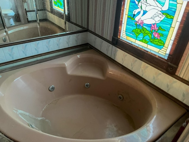 interior details featuring a tub to relax in