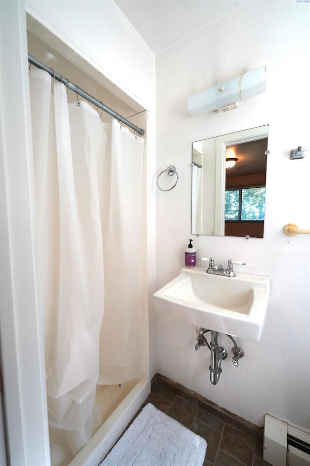 bathroom with a shower with shower curtain