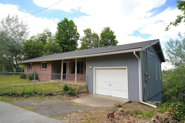 ranch-style house with a garage and a front lawn