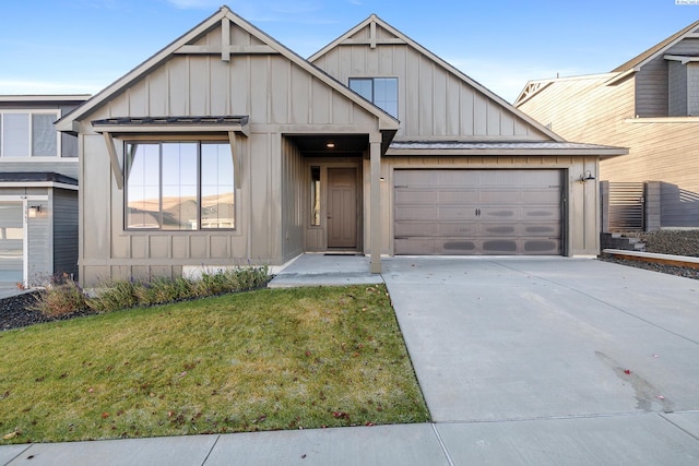 view of front of house featuring a garage and a front lawn