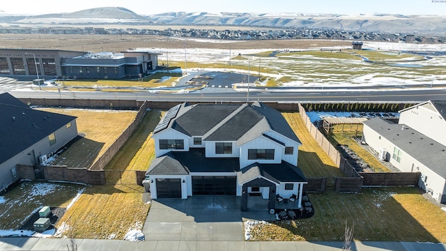 birds eye view of property featuring a residential view and a mountain view