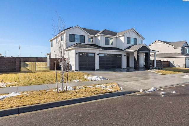 modern inspired farmhouse with driveway, a residential view, an attached garage, fence, and board and batten siding