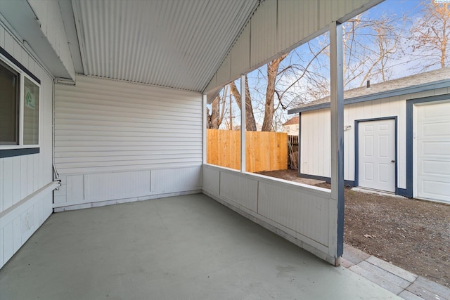 view of patio with fence and an outdoor structure