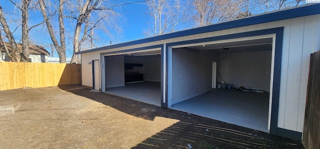 garage with fence