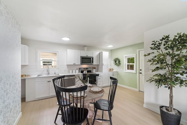 732 W Henry St, Pasco, WA 99301 - kitchen with stainless steel appliances, light wood-type flooring, white cabinetry, light countertops, and recessed lighting