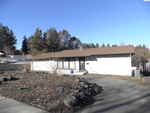 ranch-style house with central AC unit