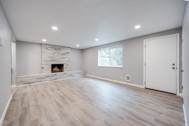 340-342 NW N St, Pullman, WA 99163 - unfurnished living room with visible vents, wood finished floors, a large fireplace, and recessed lighting