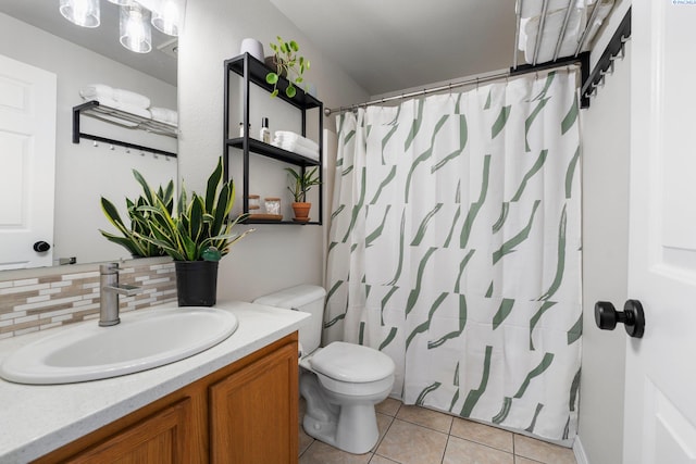 1707 W 25th Pl, Kennewick, WA 99337 - full bath featuring tile patterned flooring, toilet, tasteful backsplash, vanity, and a shower with shower curtain