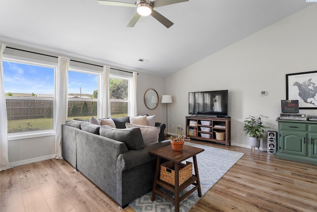 1707 W 25th Pl, Kennewick, WA 99337 - living room featuring lofted ceiling, ceiling fan, light wood-type flooring, and baseboards