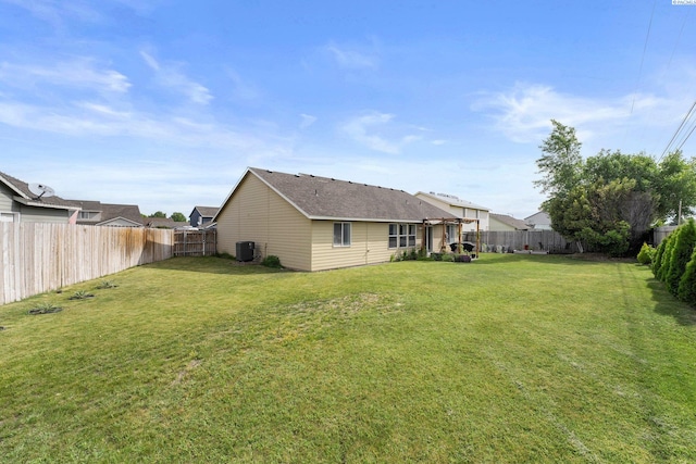 1707 W 25th Pl, Kennewick, WA 99337 - rear view of house featuring central AC and a shingled roof
