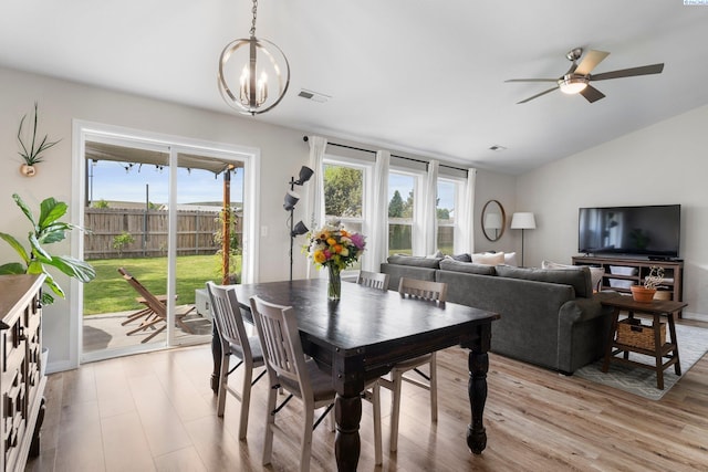1707 W 25th Pl, Kennewick, WA 99337 - dining space with ceiling fan, a chandelier, lofted ceiling, and light wood-style flooring