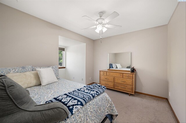 2302 W 31st Ave, Kennewick, WA 99337 - bedroom featuring light colored carpet, baseboards, and ceiling fan