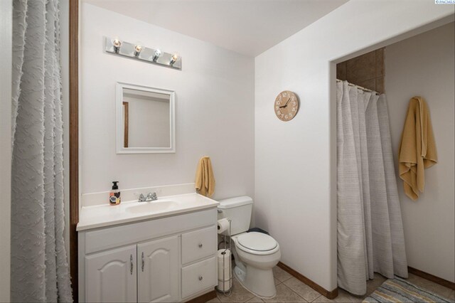 2302 W 31st Ave, Kennewick, WA 99337 - bathroom with toilet, vanity, tile patterned floors, and baseboards