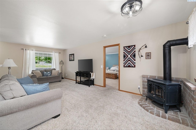 2302 W 31st Ave, Kennewick, WA 99337 - living room with a wood stove, carpet floors, and baseboards