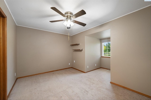 2302 W 31st Ave, Kennewick, WA 99337 - spare room featuring light carpet, ceiling fan, ornamental molding, and baseboards