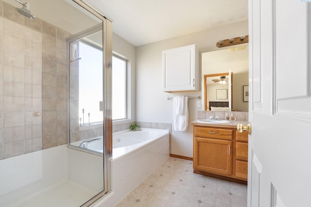 bathroom with a garden tub, a shower stall, vanity, and tile patterned floors