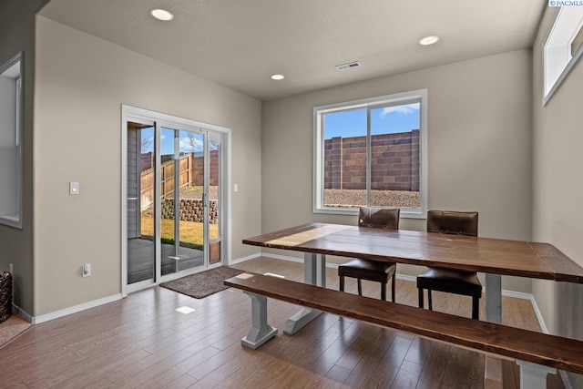 dining room featuring recessed lighting, visible vents, baseboards, and wood finished floors