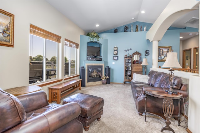 4221 S Fir St, Kennewick, WA 99337 - carpeted living area featuring recessed lighting, decorative columns, vaulted ceiling, arched walkways, and a tile fireplace