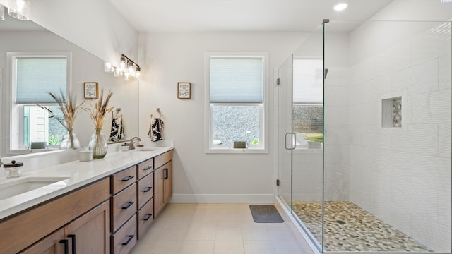 6012 W 31st Ave, Kennewick, WA 99336 - bathroom with a shower stall, double vanity, baseboards, and recessed lighting