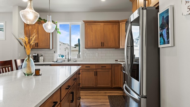 6012 W 31st Ave, Kennewick, WA 99336 - kitchen with smart refrigerator, a sink, brown cabinetry, and backsplash