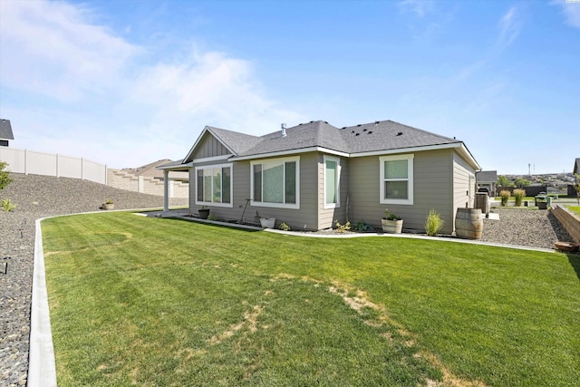 back of property featuring board and batten siding and a shingled roof