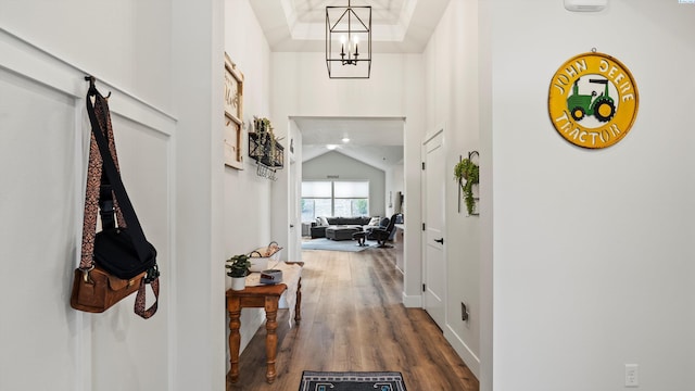 6012 W 31st Ave, Kennewick, WA 99336 - hallway with a chandelier, dark wood-style floors, lofted ceiling, and baseboards