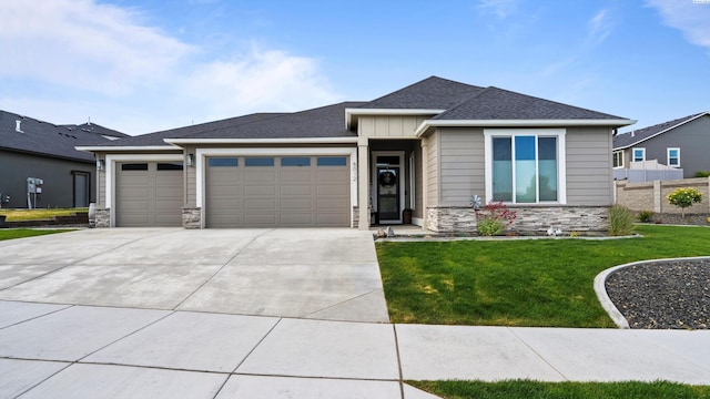 6012 W 31st Ave, Kennewick, WA 99336 - view of front of property with stone siding, a garage, a front lawn, concrete driveway, and roof with shingles