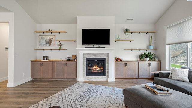 6012 W 31st Ave, Kennewick, WA 99336 - living area with wood finished floors, a glass covered fireplace, and baseboards