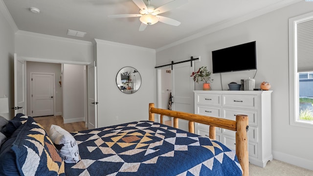 6012 W 31st Ave, Kennewick, WA 99336 - bedroom with ornamental molding, a barn door, baseboards, and a ceiling fan