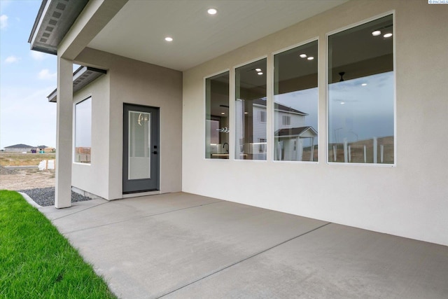 doorway to property with a patio area