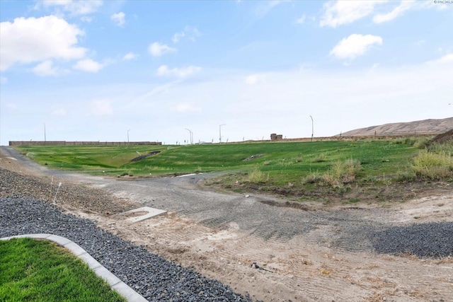 view of road featuring a mountain view and a rural view