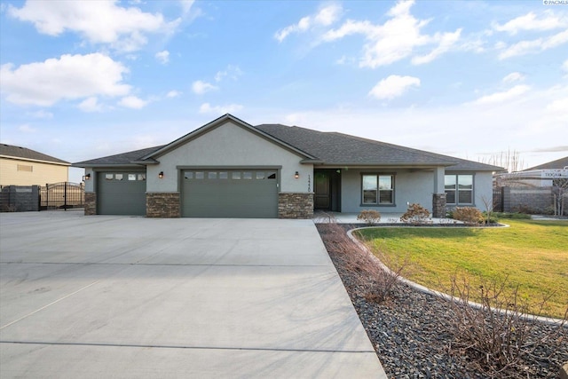 view of front facade featuring a garage and a front lawn