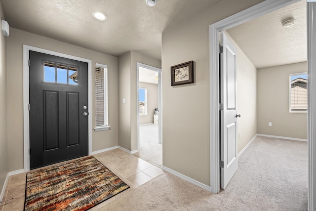 320 San Fernando Way, Prosser, WA 99350 - foyer entrance featuring baseboards, recessed lighting, a textured ceiling, and light colored carpet