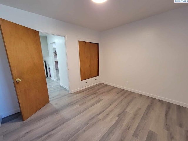 208 E 4th St, Grandview, WA 98930 - unfurnished bedroom featuring baseboards and wood finished floors