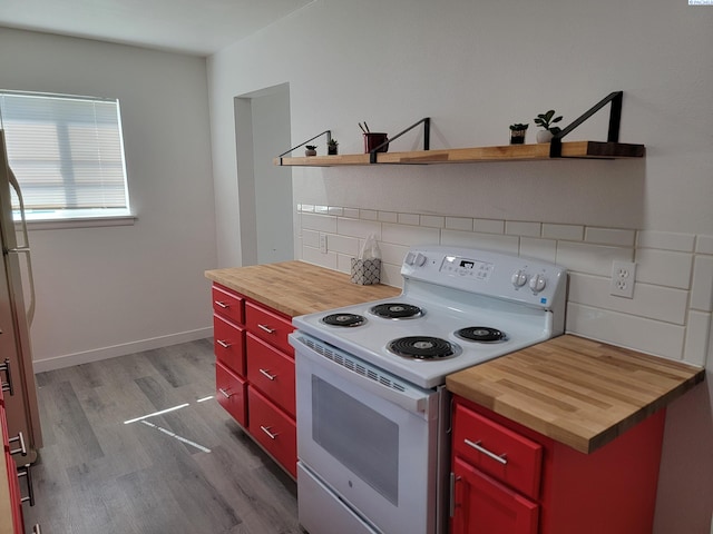 208 E 4th St, Grandview, WA 98930 - kitchen featuring wood counters, white electric range oven, red cabinetry, open shelves, and wood finished floors