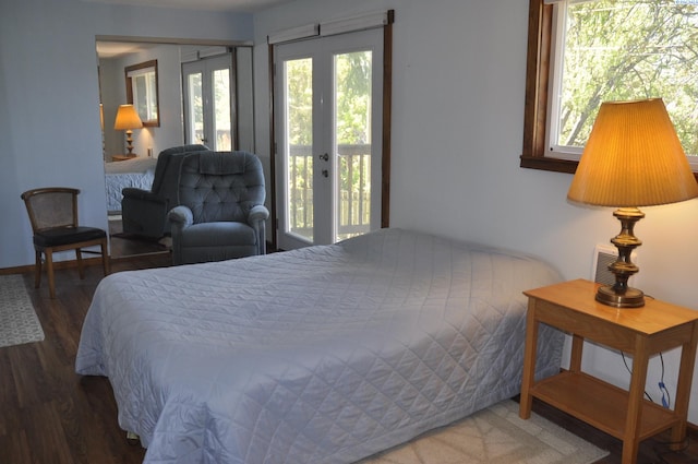 bedroom featuring access to outside and wood finished floors