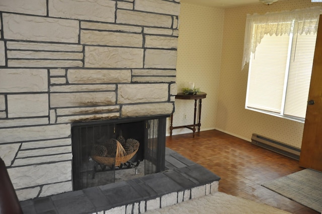 interior details with a fireplace, wood finished floors, baseboards, a baseboard radiator, and wallpapered walls