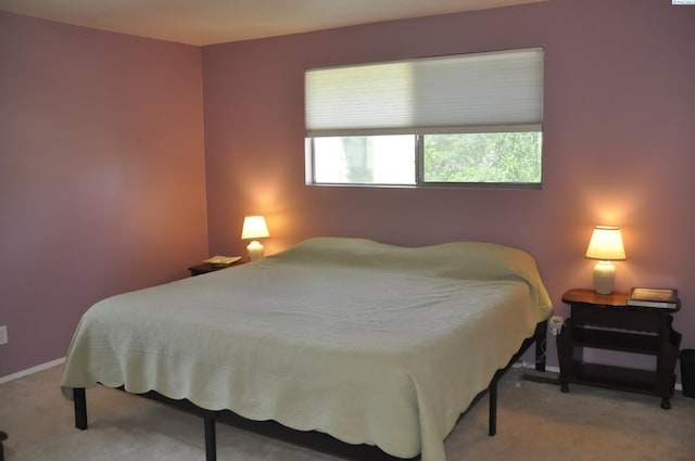 carpeted bedroom with baseboards