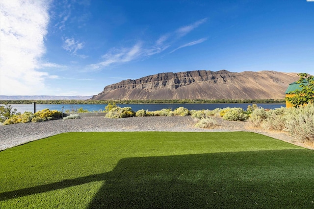 view of mountain feature featuring a water view