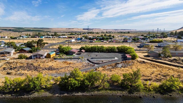 birds eye view of property featuring a mountain view