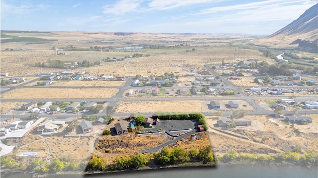 birds eye view of property featuring a mountain view