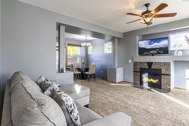 939 S Keller St, Kennewick, WA 99337 - carpeted living area featuring a chandelier, a ceiling fan, baseboards, and a tile fireplace
