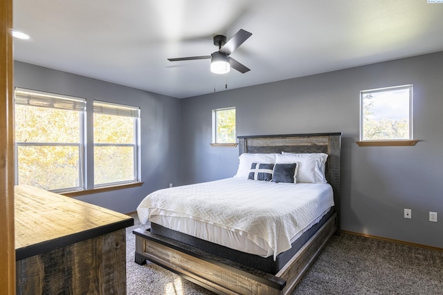 bedroom with baseboards, carpet, and a ceiling fan